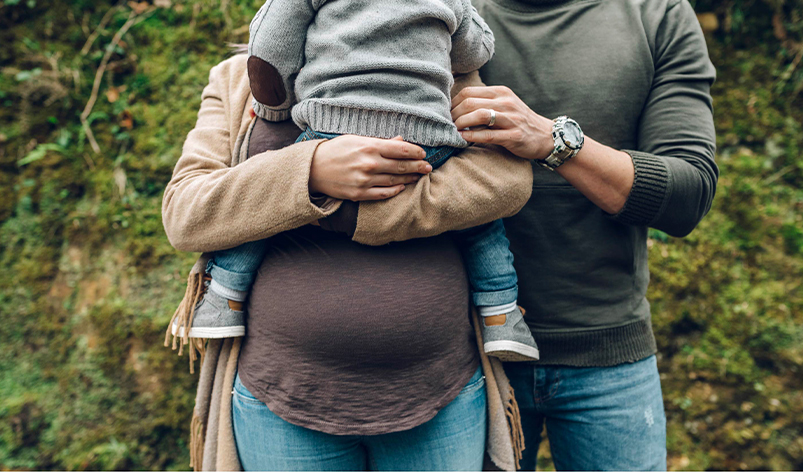 photo: couple holding baby